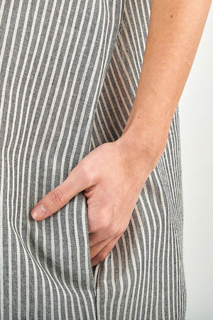 Close-up of hand in pocket on striped linen blend gauze shirt dress fabric
