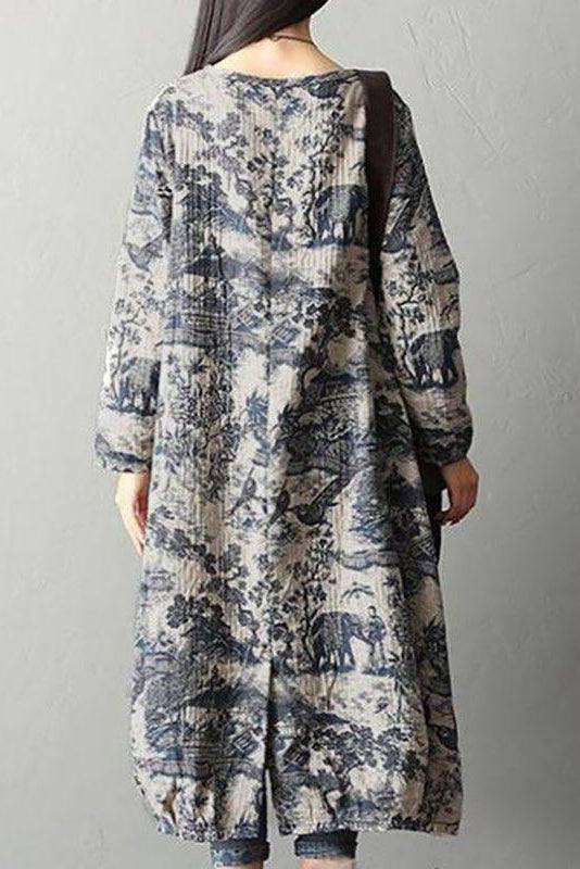 Back view of loose fit Japanese porcelain print midi dress with long sleeves and blue pattern on light beige background