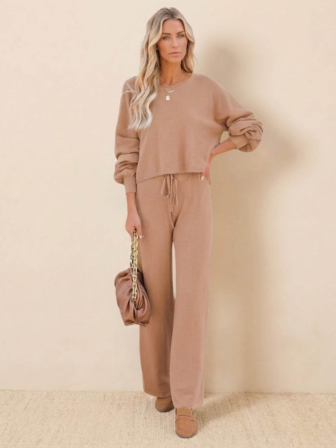 Woman wearing brown round neck loose fit cozy two-piece set with long sleeves and wide-leg pants