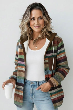 Woman wearing Highland Plaid Shacket with hood, multicolor stripes, button-front, and front pockets, styled with white top and jeans