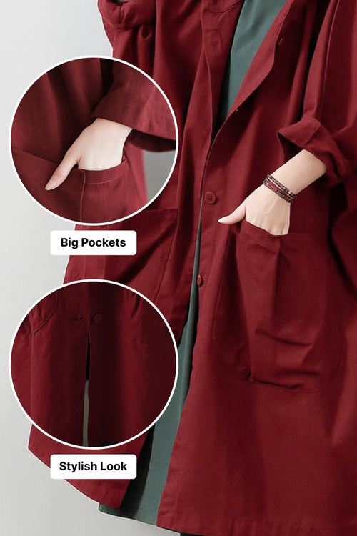 Oversized water resistant windbreaker jacket in deep red with large front pockets and attached hood for stylish, practical layering
