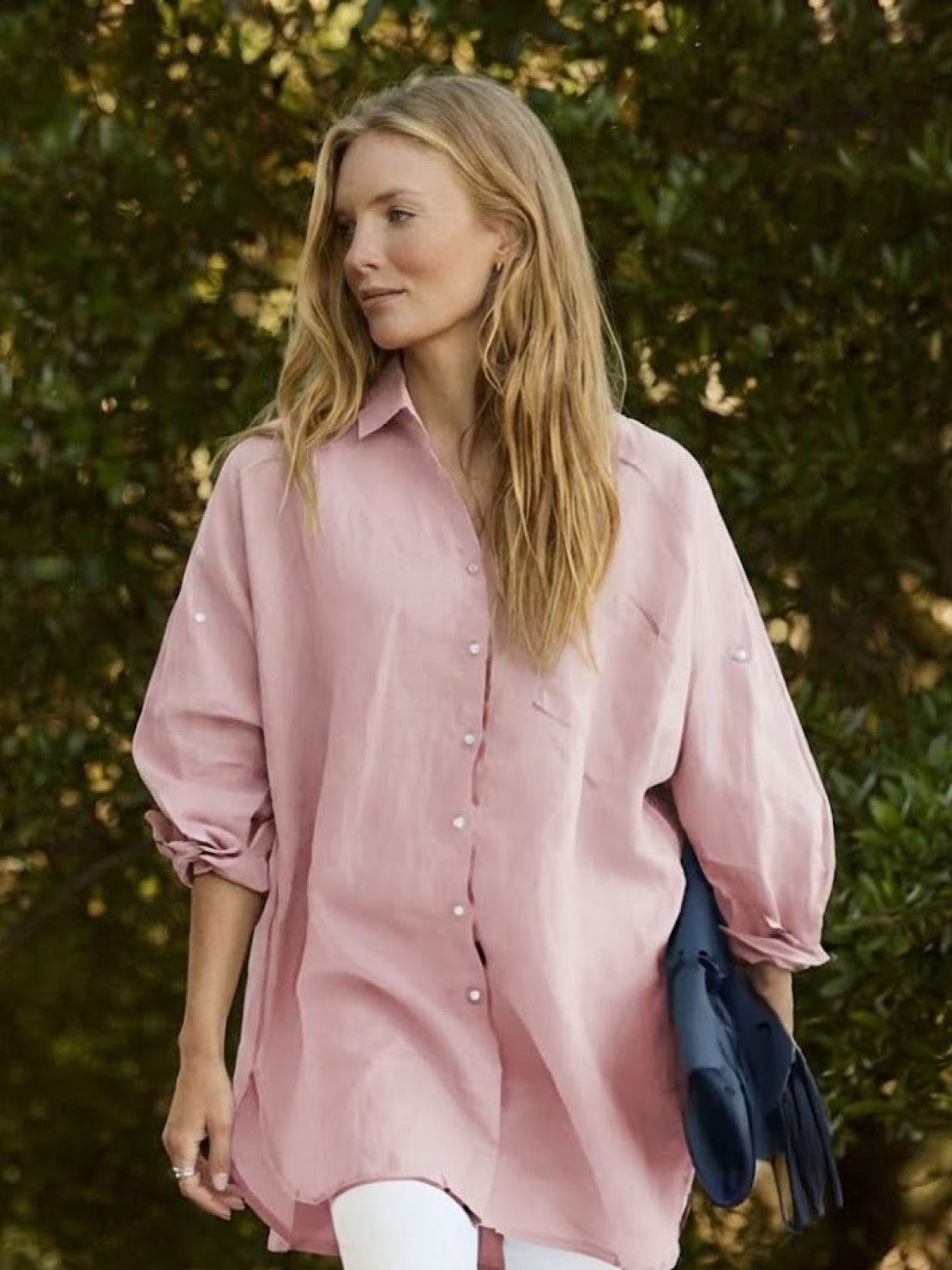 Oversized linen shirt in white with breathable cotton blend and relaxed fit on model