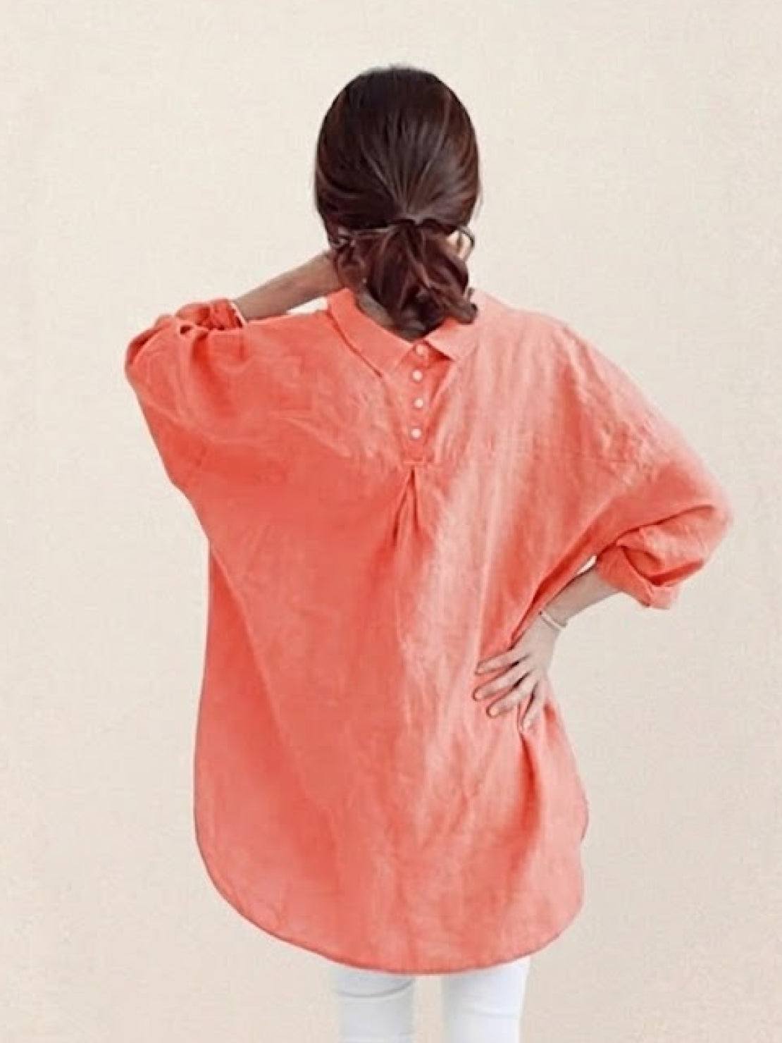 Oversized linen shirt in soft white cotton-linen blend with relaxed fit and back button detail