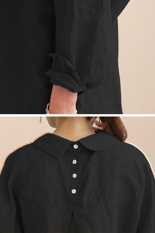 Black oversized linen shirt with rolled sleeves and back button detailing