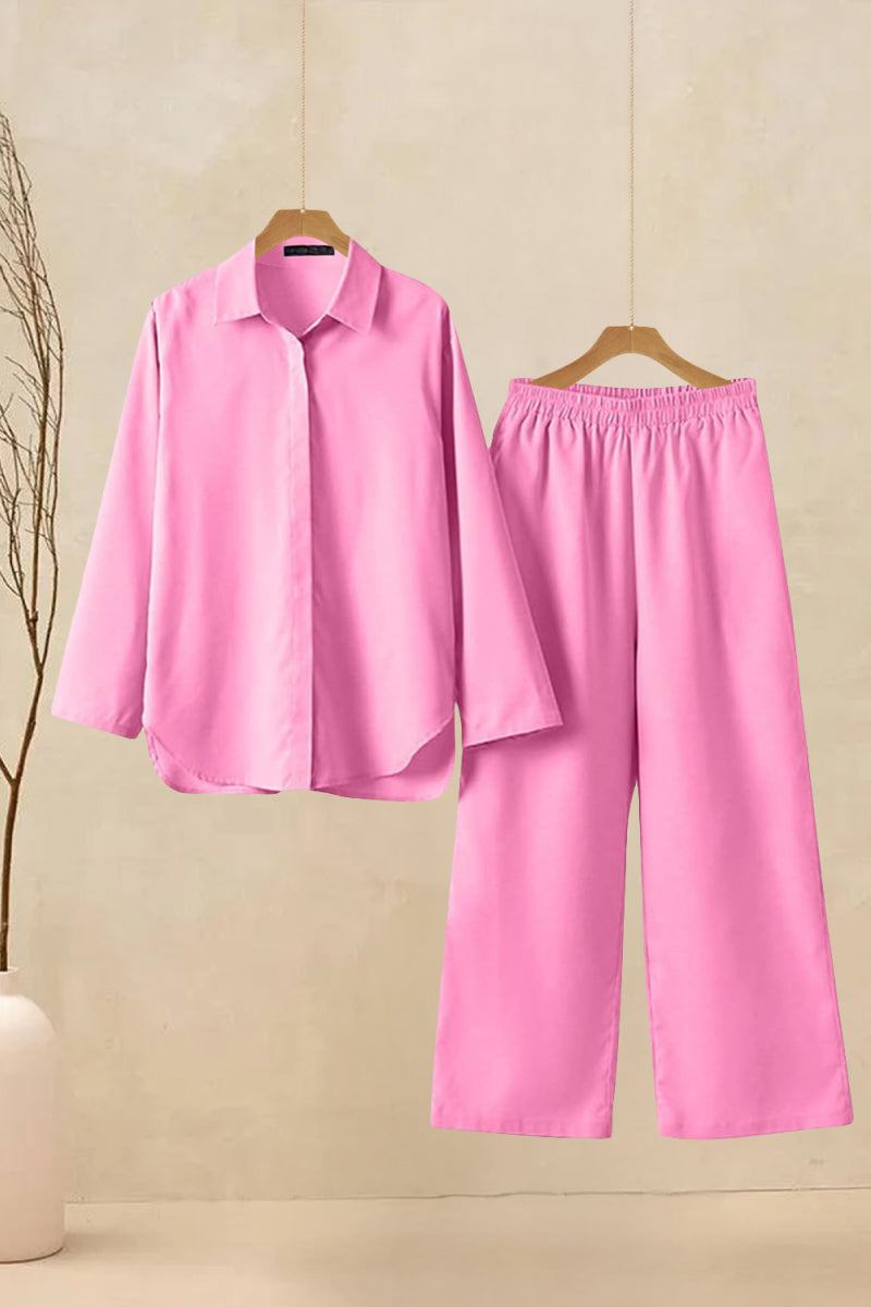 Oversized 100% cotton pink shirt and wide-leg pants co-ord set hanging on hangers