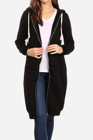Woman wearing black oversized long zip sweatshirt hoodie with drawstring hood and large front pockets