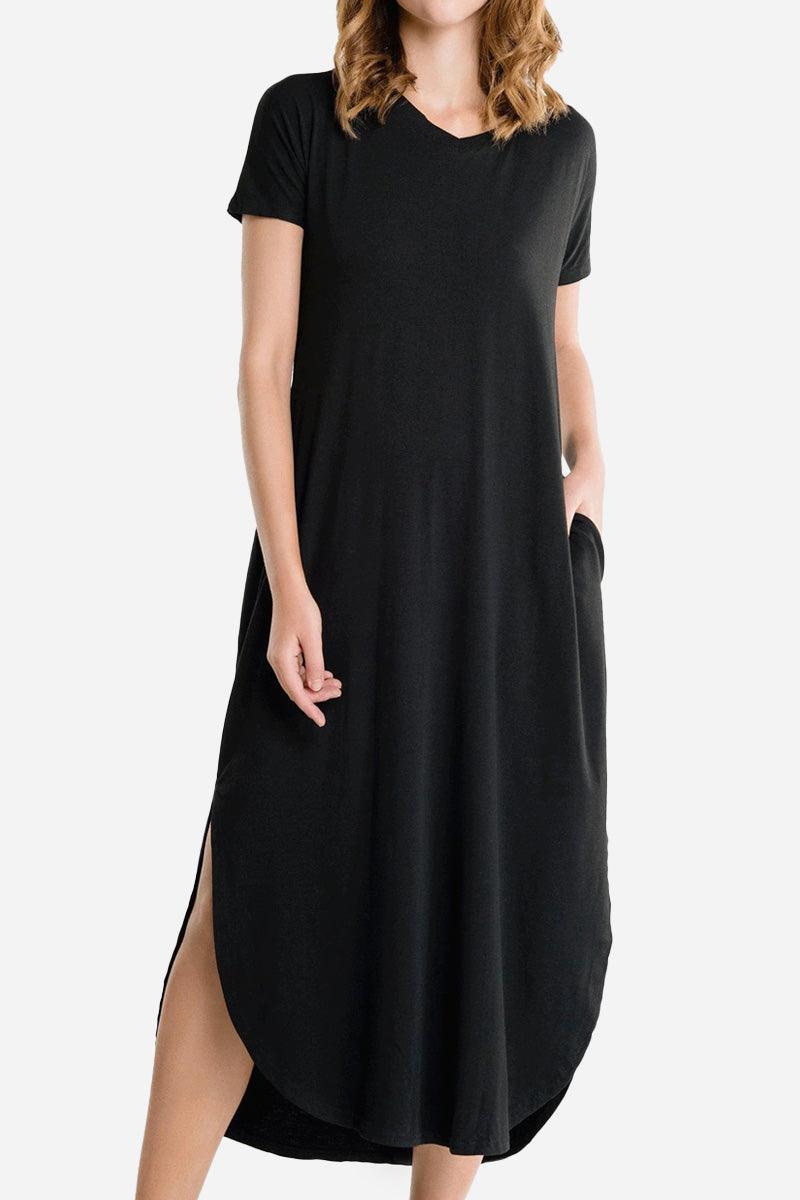 Black side slit maxi dress with pockets and short sleeves on a model
