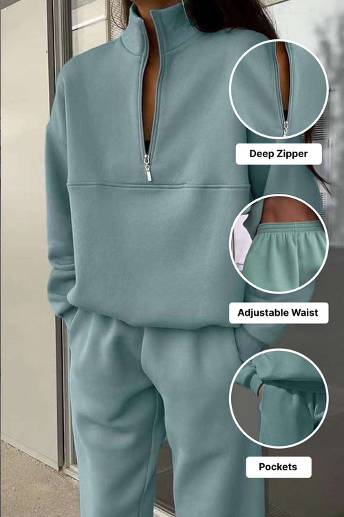 Woman wearing mint green cotton blend tracksuit with deep zipper, adjustable waist, and pockets