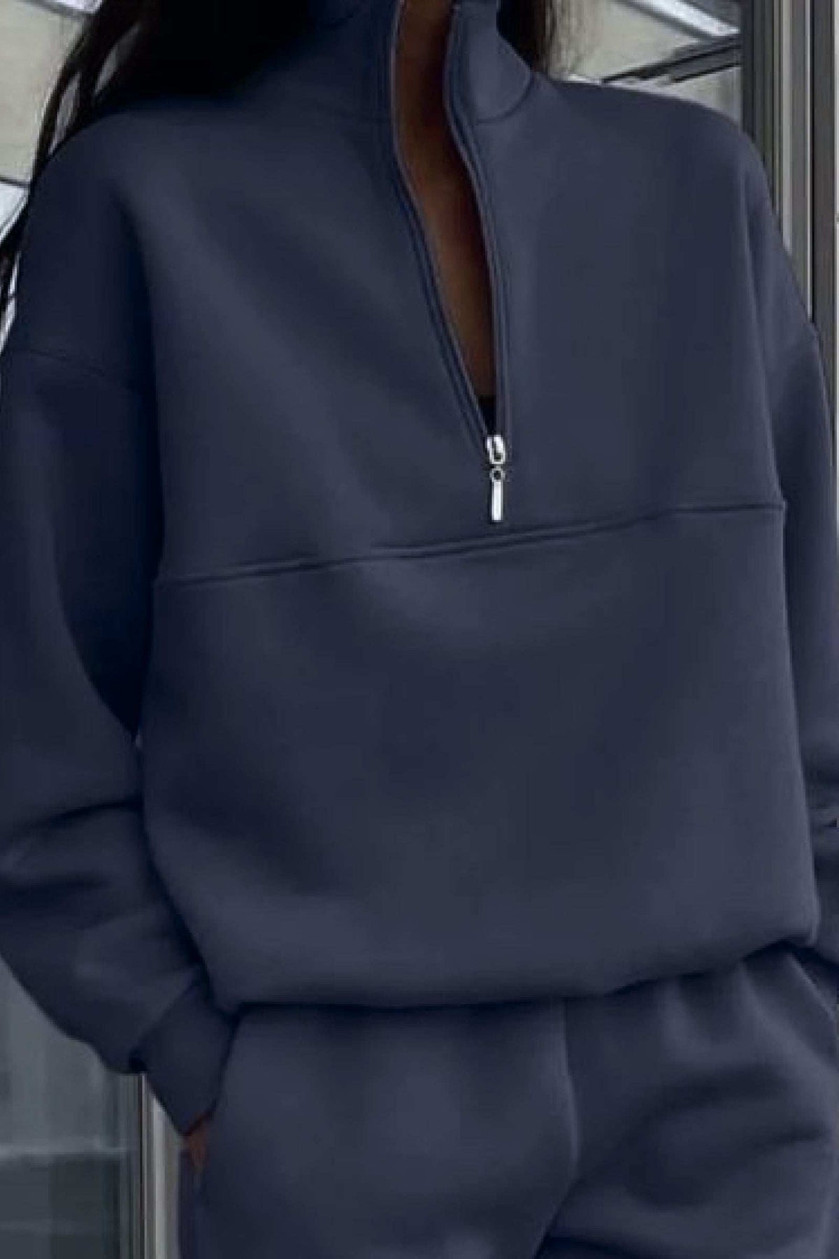 Navy cotton blend tracksuit with high collar, deep zipper, and relaxed fit for casual comfort and style