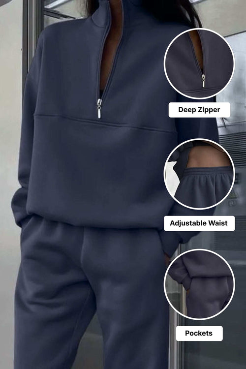Navy cotton blend tracksuit with deep zipper, adjustable waist, and pockets for tailored comfort and minimalist style.