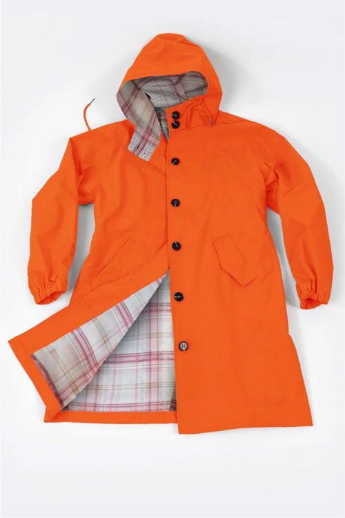 Orange Rain Couture Windbreaker with hood and plaid interior lining, water-resistant oversized jacket designed for style and comfort
