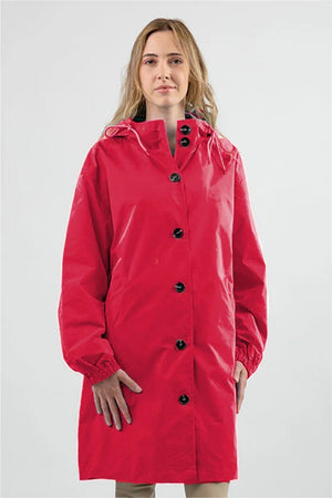Woman wearing red oversized Rain Couture Windbreaker water-resistant jacket with hood and buttons.