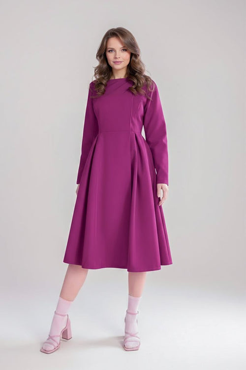Woman wearing a purple water-repellent rain A-line dress coat with long sleeves and fitted waist belt