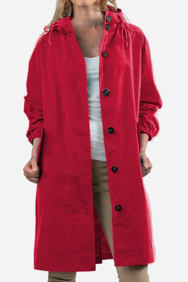 Red oversized Rain Couture Windbreaker with hood and button closure on model.