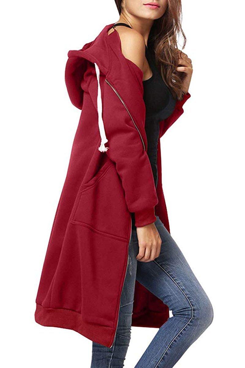 Woman wearing oversized long zip sweatshirt hoodie in red with hood and front pockets