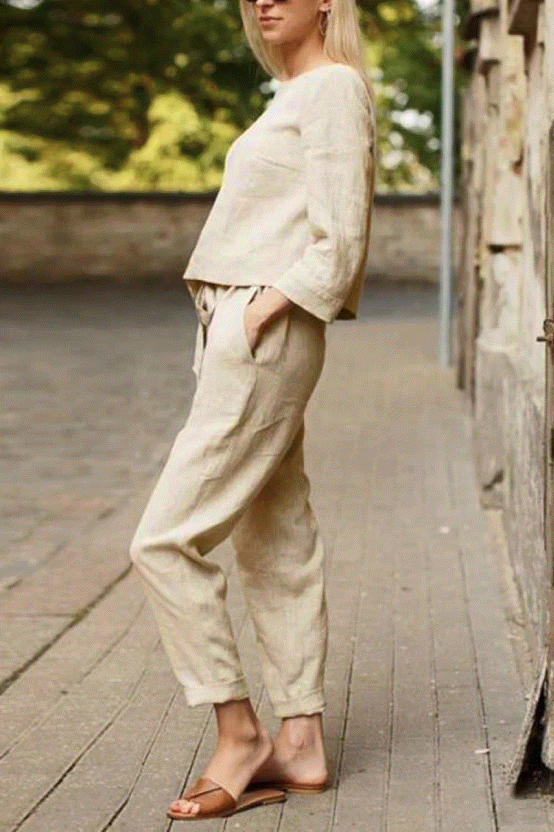 Woman wearing relaxed cotton-linen monochrome longline top and wide-leg pants set outdoors