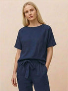 Cotton linen monochrome top with relaxed short sleeves and breathable fabric texture