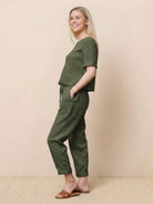 Woman wearing relaxed monochrome cotton linen set with short-sleeve top and straight-leg pants
