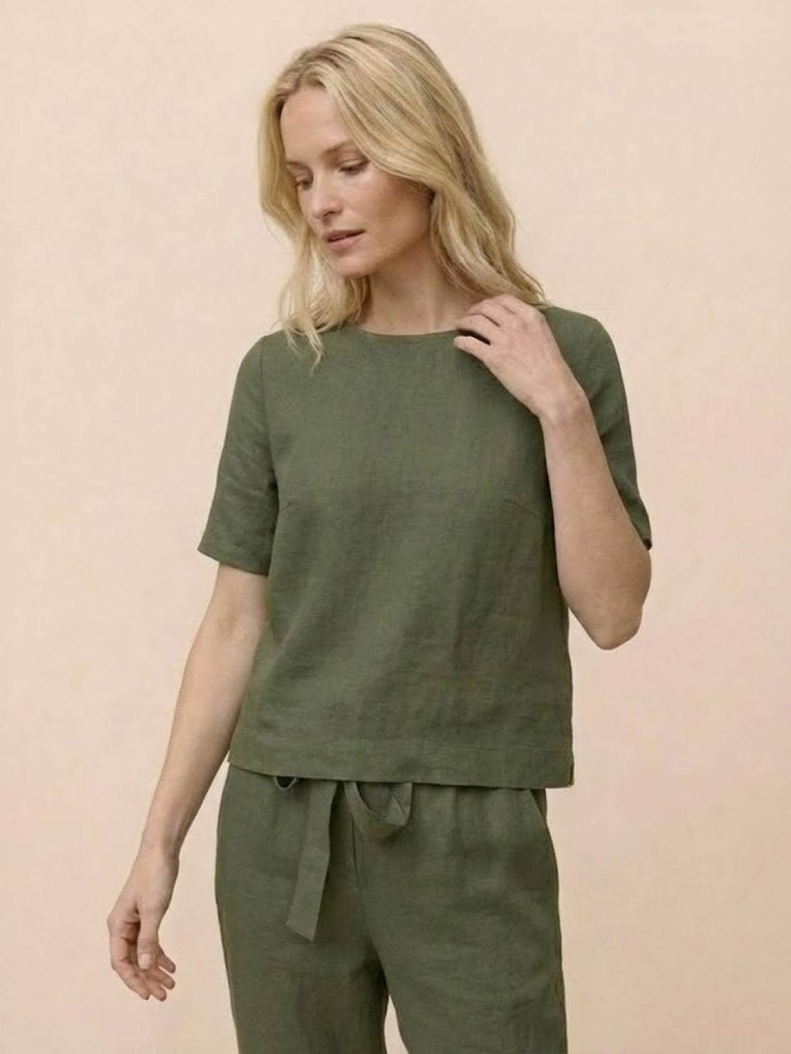 Woman wearing a breathable cotton linen set with relaxed monochrome top and pants