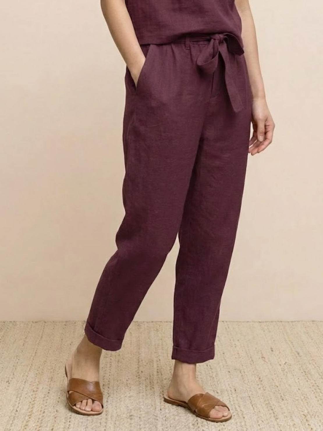 woman wearing relaxed cotton linen set with monochrome short-sleeve top and straight-leg pants