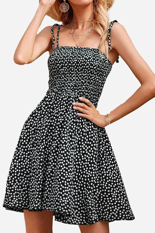 Black and white bohemian skater dress with polka dots and sling knot straps
