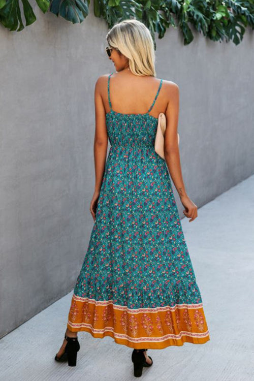 Woman wearing a vintage flower prints casual maxi dress with spaghetti straps and open back.