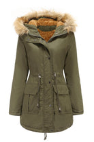 Large hooded velvet coat in olive green with faux fur trim and multiple pockets