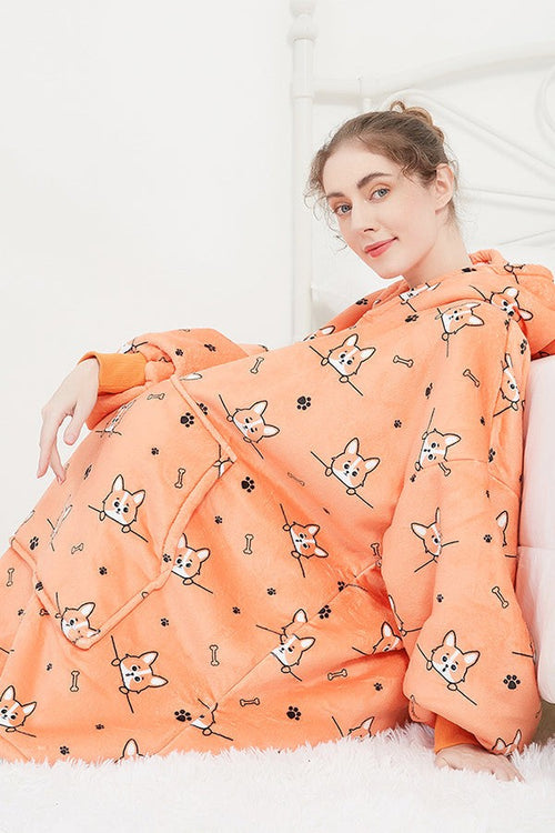 Snuggly oversized hooded fleece sweater in orange with cartoon dog print, featuring a large front pocket and cozy soft material.