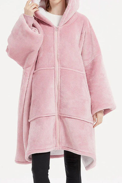 Pink oversized ultra soft hooded blanket with zipper and large front pockets for warmth.