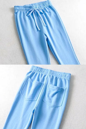 Light blue comfy wide-leg pants with elastic waistband and back pockets made from breathable sustainable fabric