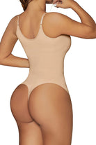 Back view of woman wearing beige seamless TummyToning Bodysuit with adjustable straps and thong style.