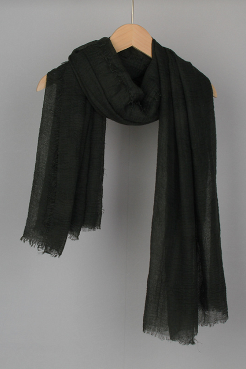 Black lightweight eco-linen Color-POP Scarf hanging on wooden hanger, breathable and all-weather ready accessory