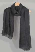 Black linen Color-POP Scarf hanging on wooden hanger, lightweight and warm eco-friendly fabric