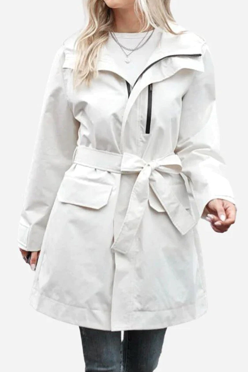White water-resistant windbreaker trench jacket with belt and pockets on female model