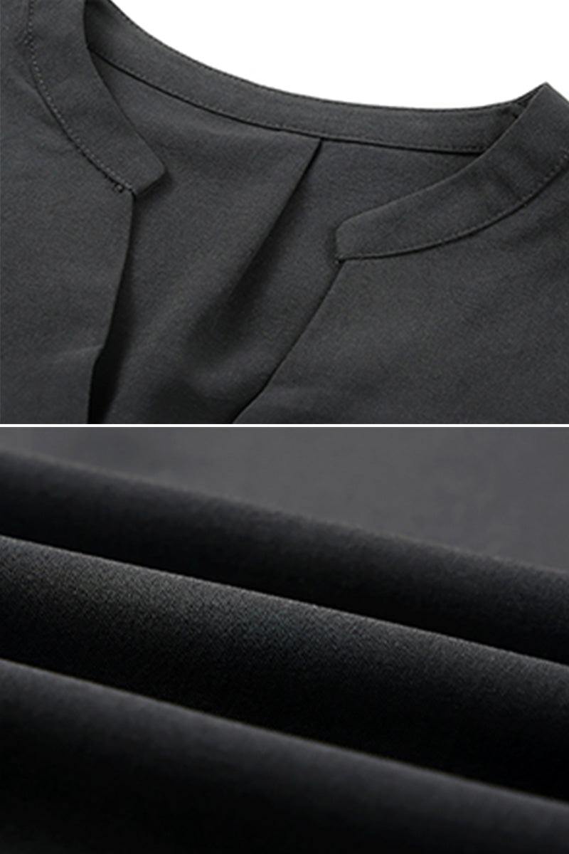 Close-up of black Dainty Charm Casual Ruffle Dress fabric and neckline details made of breathable polyester