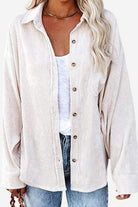 Sleek suede oversized button-down shirt in light beige with front buttons and relaxed fit