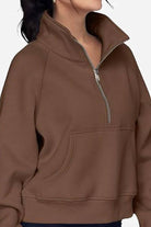Cozy oversized half-zip fleece pullover sweatshirt in brown with a front pocket and relaxed fit