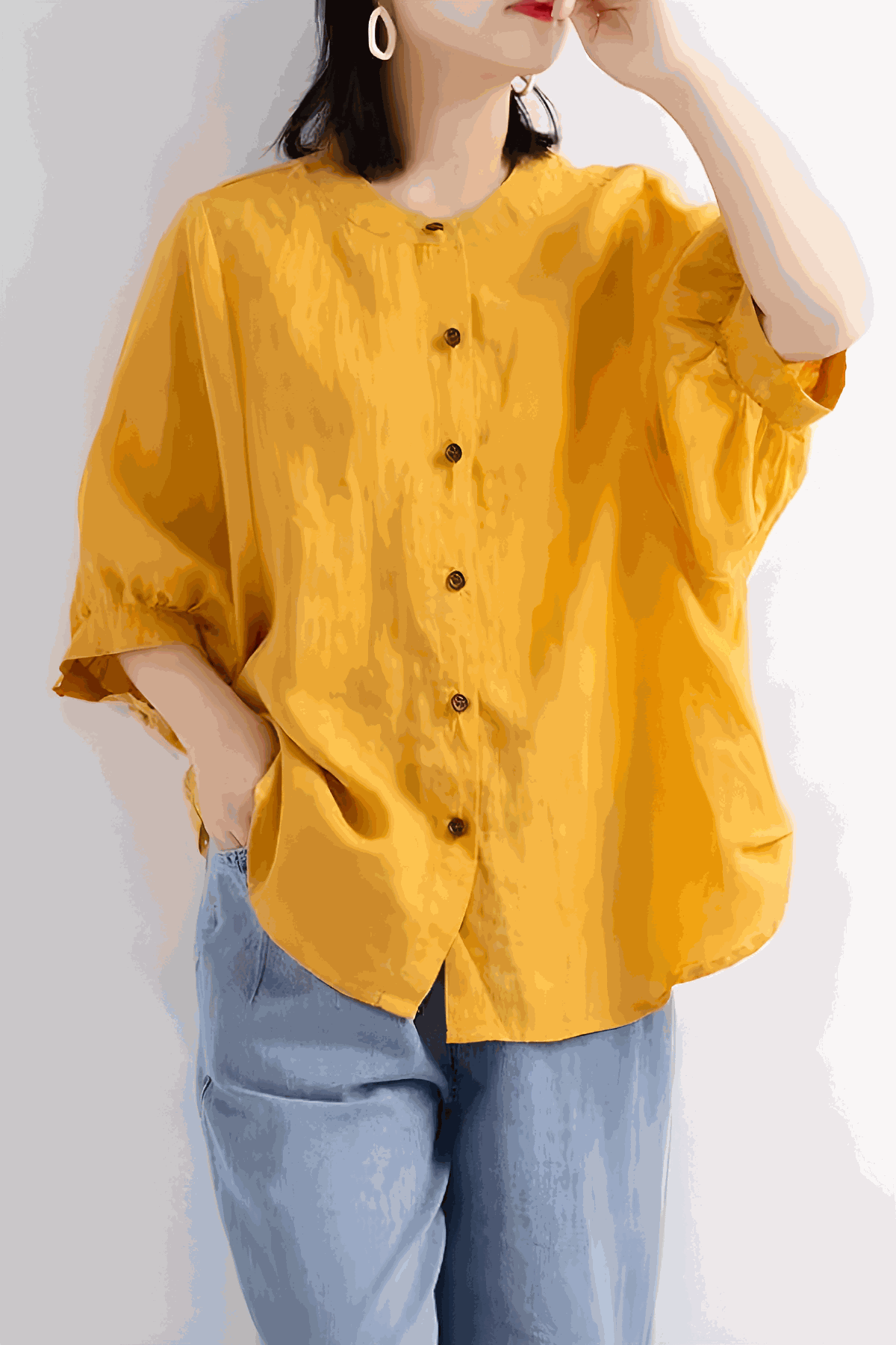 Relaxed loose breathable linen blouse in vibrant mustard yellow with button-down front and 3/4 sleeves.