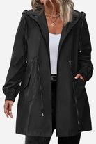 Black packable water-resistant windbreaker jacket with hood and front pockets for women
