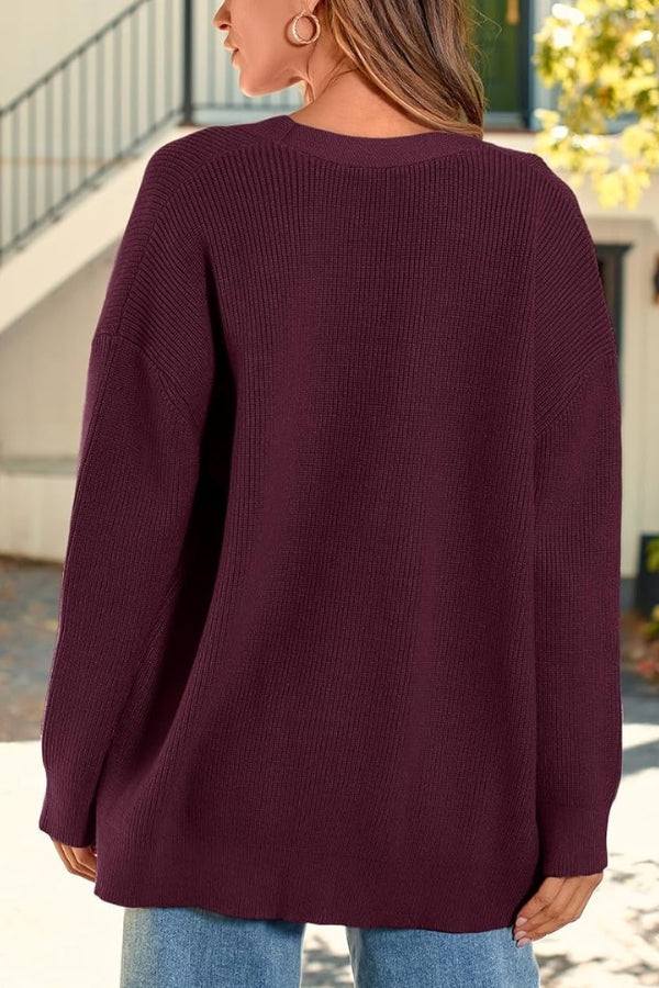 Relaxed fit oversized knitwear cardigan in deep burgundy with long sleeves and button-down front.