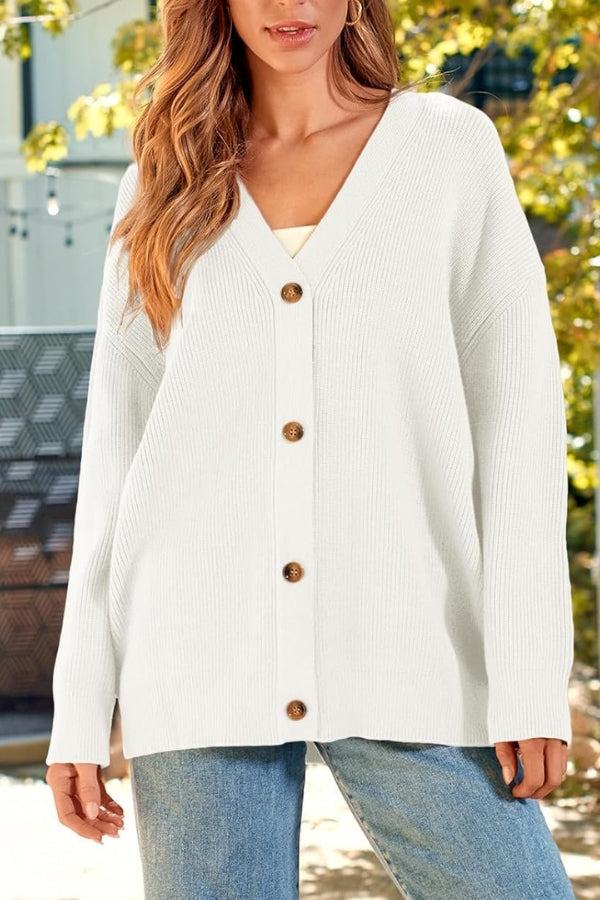 Relaxed fit oversized white button-down knitwear cardigan on model outdoors