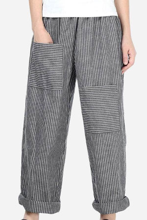 High waist striped comfort pants with large patch pockets and rolled cuffs on model