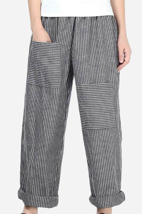 High waist striped comfort pants with large patch pockets and rolled cuffs on model