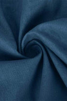 Blue cotton fabric close-up for short-sleeved V-neck top and wide trouser suit