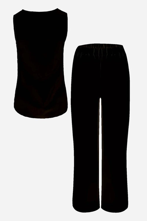 Black two-piece co-ord with sleeveless top and elastic waist trousers for apple-shaped body balancing