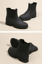 Black non-slip rain boots with waterproof design and SuperGrip soles for enhanced traction and comfort
