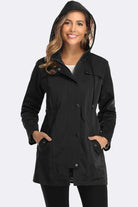 Woman wearing elegant plaid raincoat windbreaker black hooded jacket with checkered lining