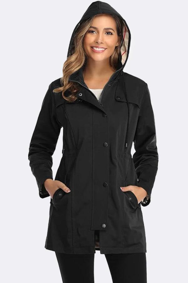 Woman wearing elegant plaid raincoat windbreaker black hooded jacket with checkered lining