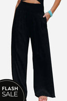 Black high-waist polyester palazzo pants with wide legs and pockets for women