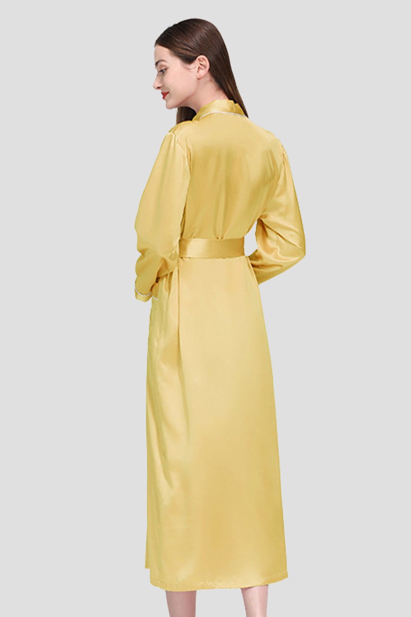 Woman wearing a yellow 100% mulberry silk belted classy nightgown, shown from the back